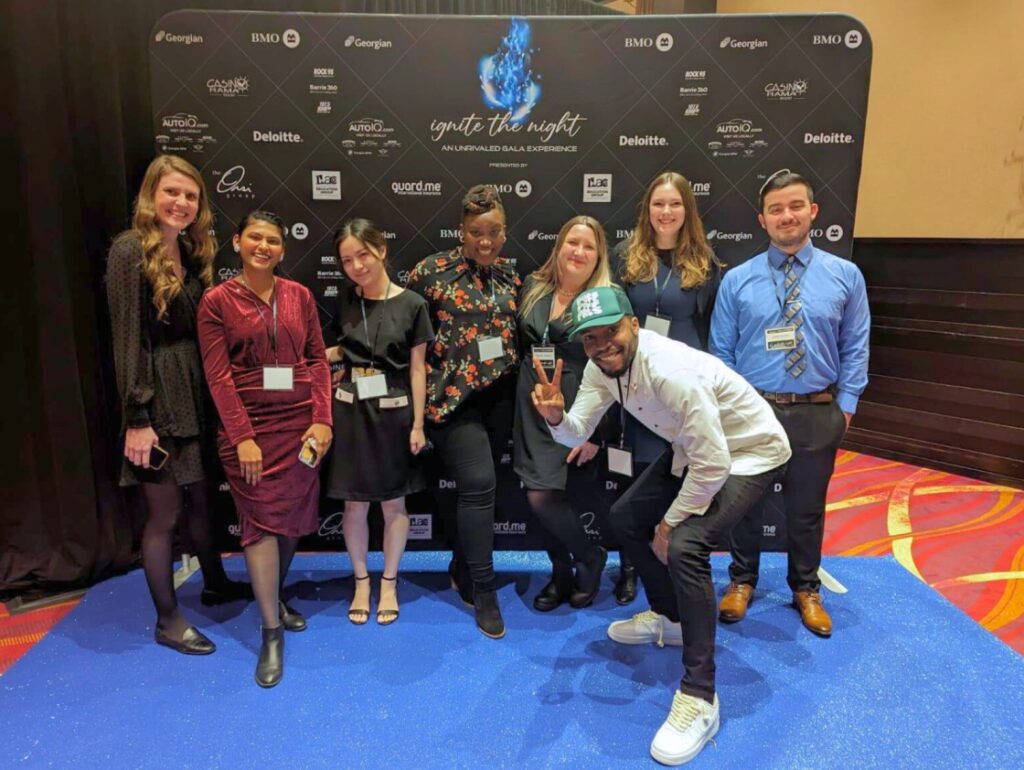 after the gala for a relaxed group photo, sharing smiles and casual conversations.